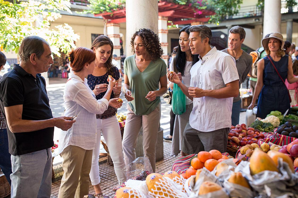 A group enjoys local foods on a Globus tour