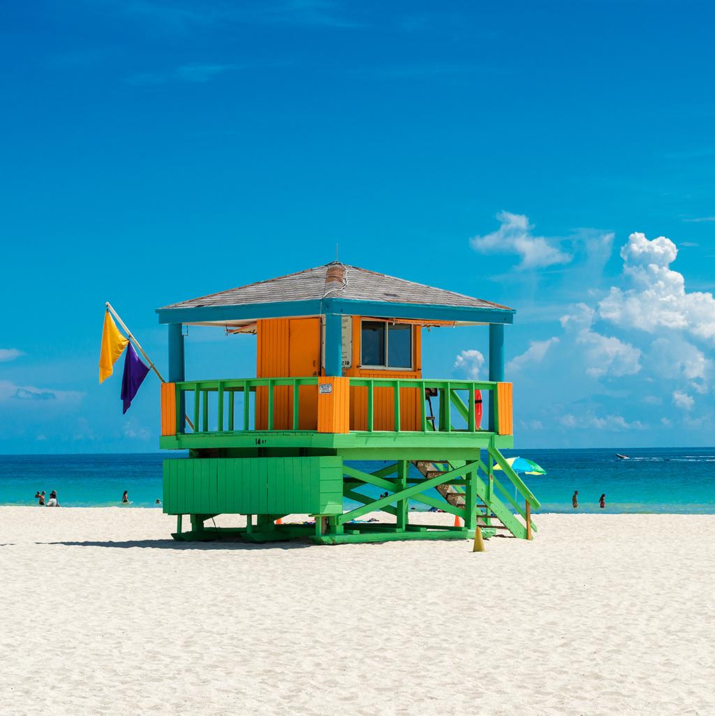 brightly colored lifeguard tower on a sunny beach