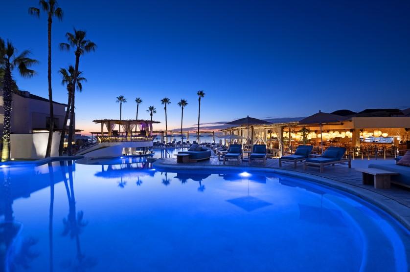 The pool at dusk at a ME by Melia resort